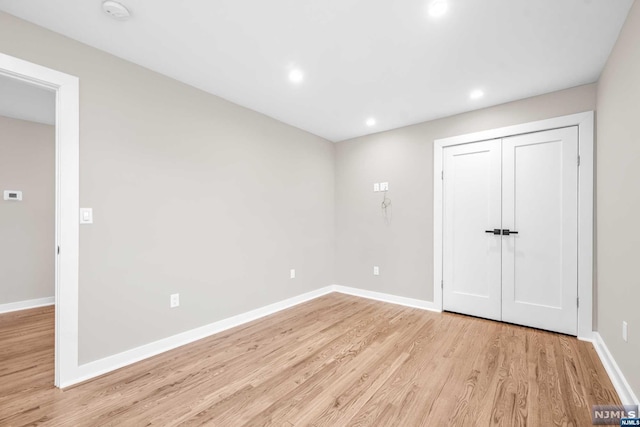 empty room with light hardwood / wood-style floors