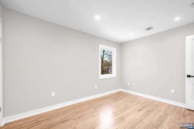 unfurnished room featuring light hardwood / wood-style flooring