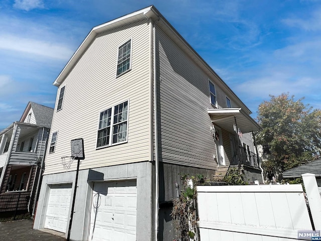 view of property exterior with a garage