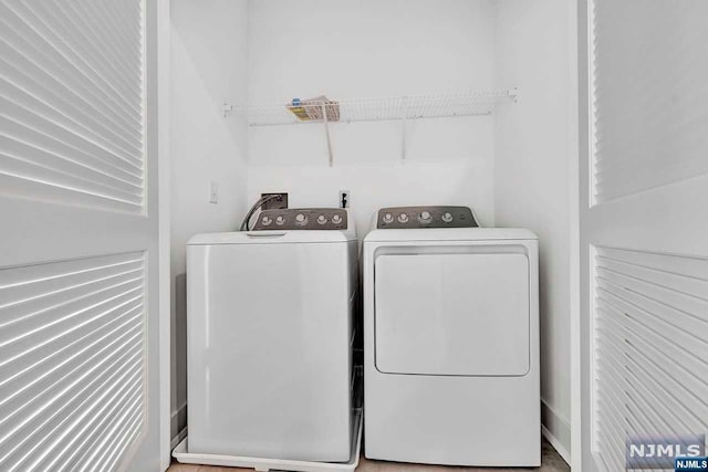 clothes washing area featuring washing machine and dryer