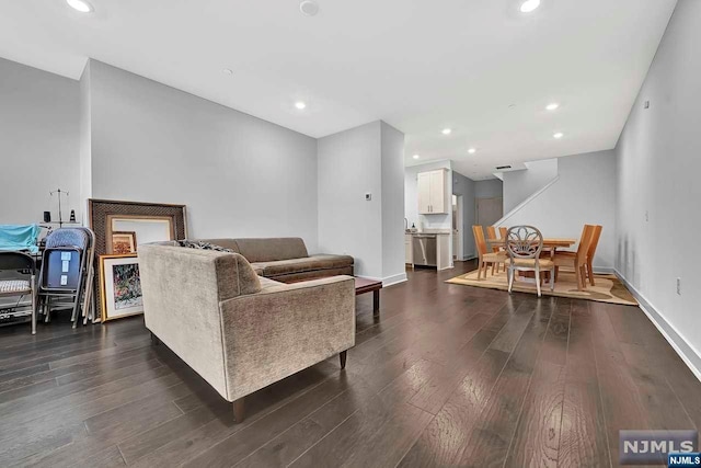 living room with dark hardwood / wood-style floors