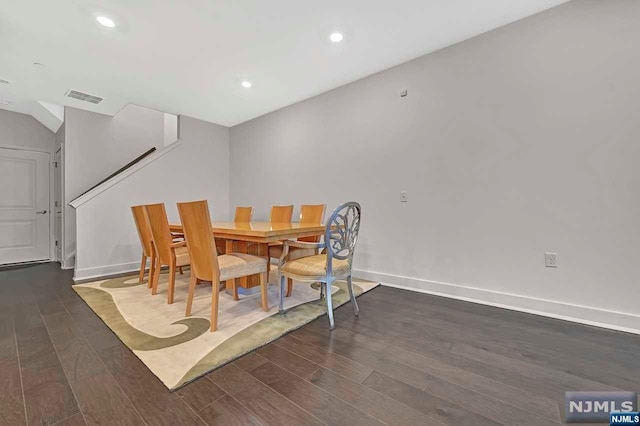 dining area with dark hardwood / wood-style floors