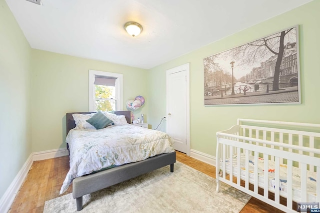 bedroom featuring hardwood / wood-style flooring