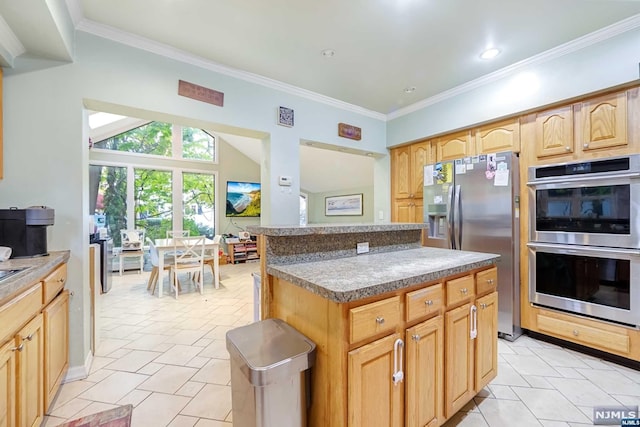 kitchen with crown molding, a center island, stainless steel appliances, and light brown cabinets