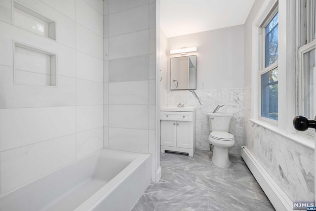 bathroom featuring plenty of natural light, a baseboard radiator, tile walls, and toilet