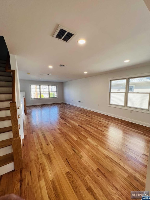 unfurnished living room with light hardwood / wood-style floors