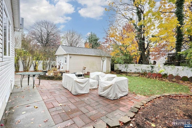 view of patio / terrace with an outbuilding