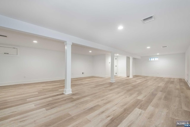 basement featuring light hardwood / wood-style floors