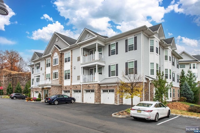 townhome / multi-family property featuring a garage