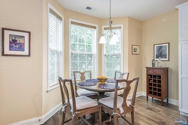 dining area featuring wood-type flooring