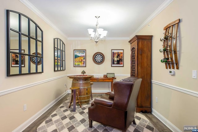 office space with hardwood / wood-style flooring, crown molding, and a notable chandelier