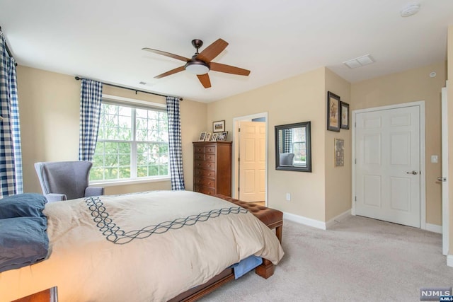 carpeted bedroom featuring ceiling fan