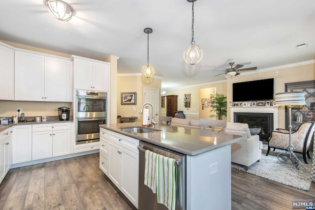 kitchen featuring sink, white cabinets, dark hardwood / wood-style floors, and appliances with stainless steel finishes