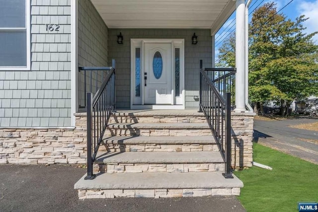 property entrance with a porch