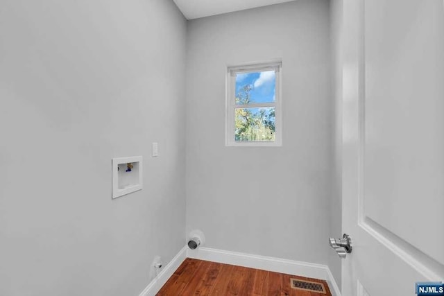 laundry area with hookup for a washing machine and wood-type flooring