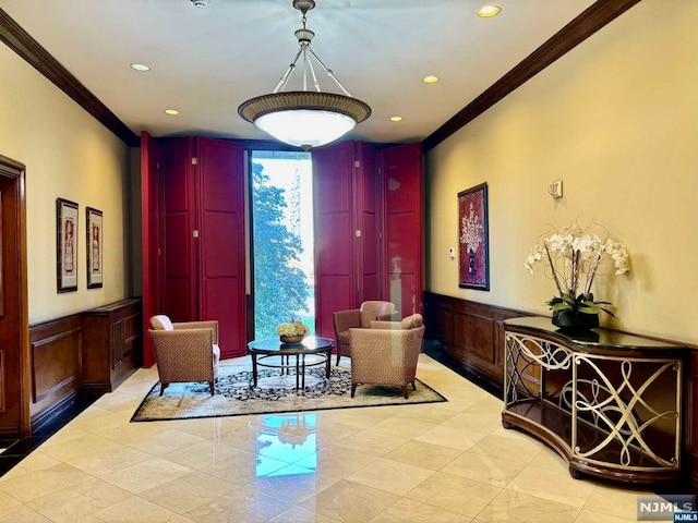 living area with crown molding