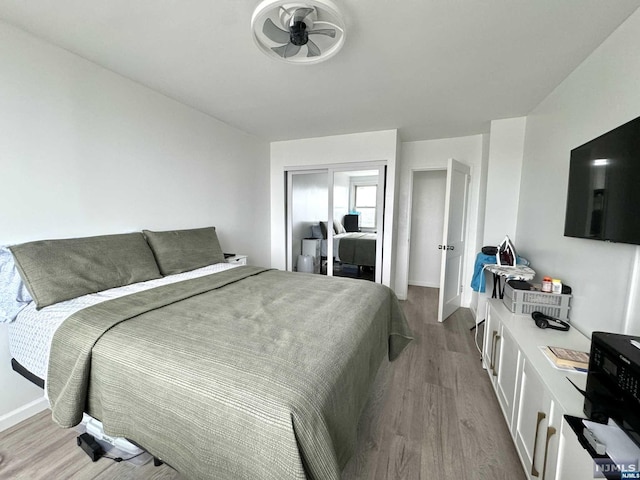 bedroom with light hardwood / wood-style floors