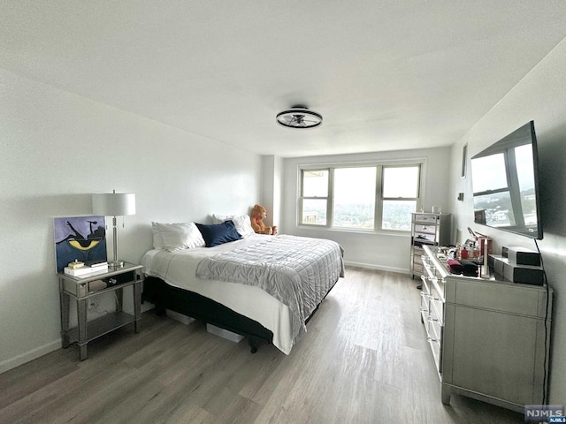 bedroom featuring hardwood / wood-style flooring