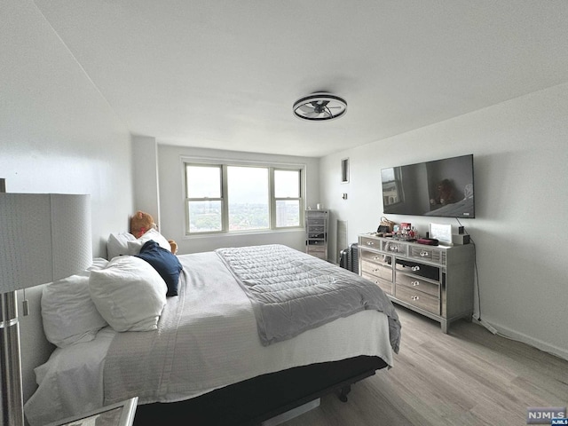 bedroom with light hardwood / wood-style floors