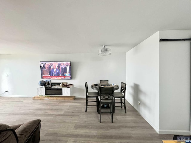 dining space featuring hardwood / wood-style flooring