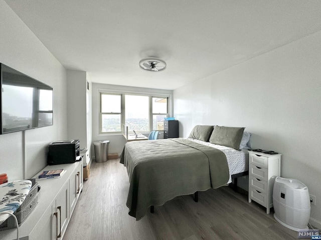 bedroom with wood-type flooring