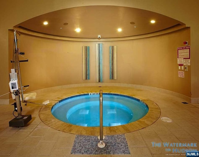 view of pool with an indoor in ground hot tub