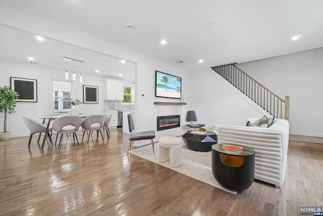 living room with light hardwood / wood-style flooring