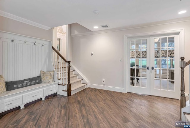 interior space with french doors, crown molding, and dark wood-type flooring