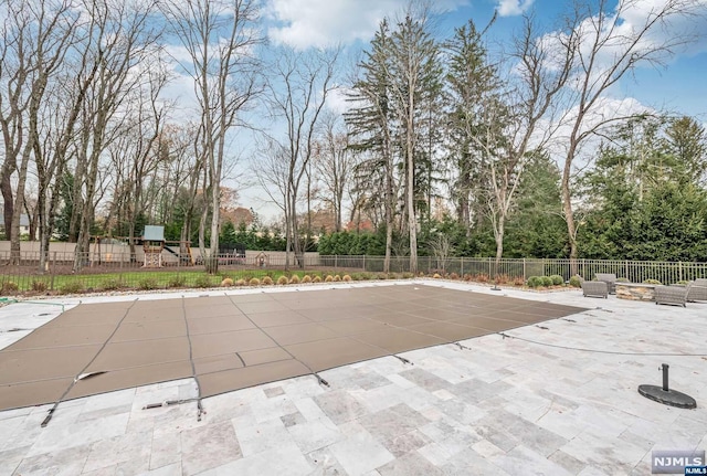 view of pool featuring a patio