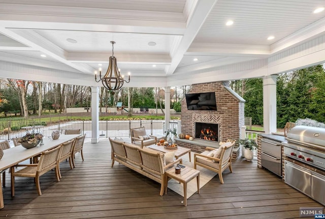 wooden deck featuring an outdoor living space with a fireplace and a grill