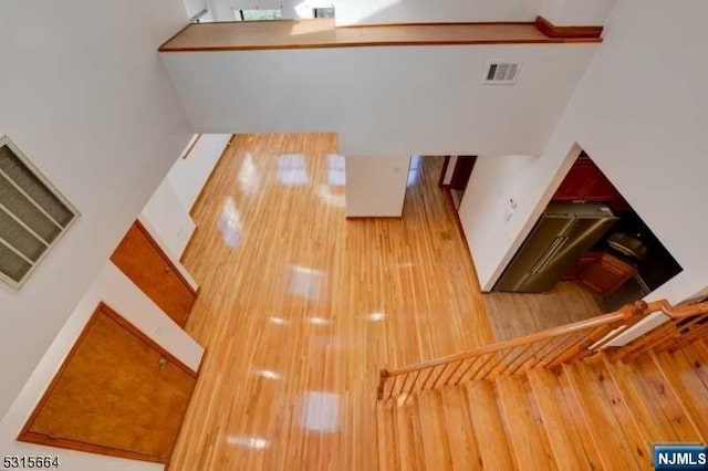 unfurnished living room with hardwood / wood-style flooring