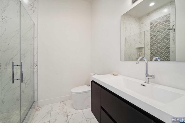 bathroom with vanity, toilet, and walk in shower