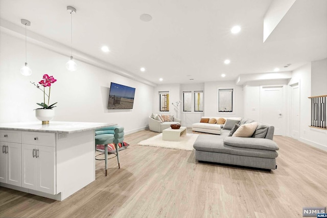 living room with light hardwood / wood-style floors