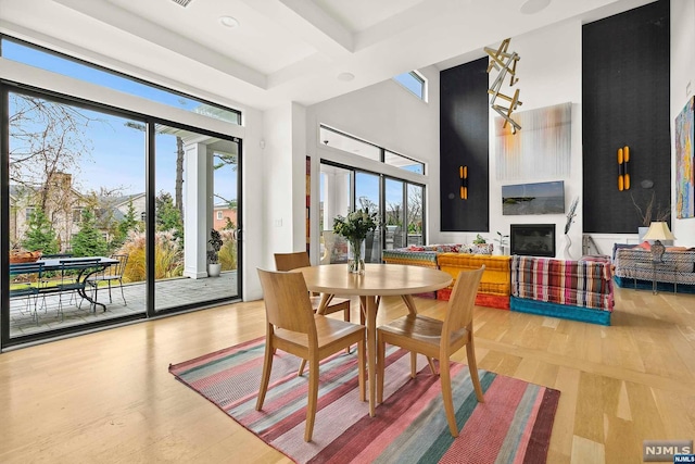 dining area featuring a healthy amount of sunlight and light wood-type flooring