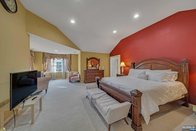 bedroom featuring light colored carpet and lofted ceiling