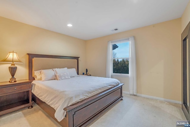 bedroom featuring light colored carpet