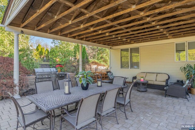 view of patio featuring a grill and an outdoor hangout area