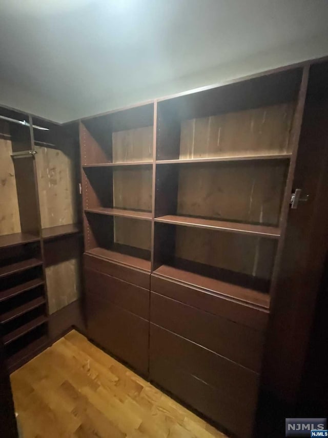 walk in closet featuring wood-type flooring