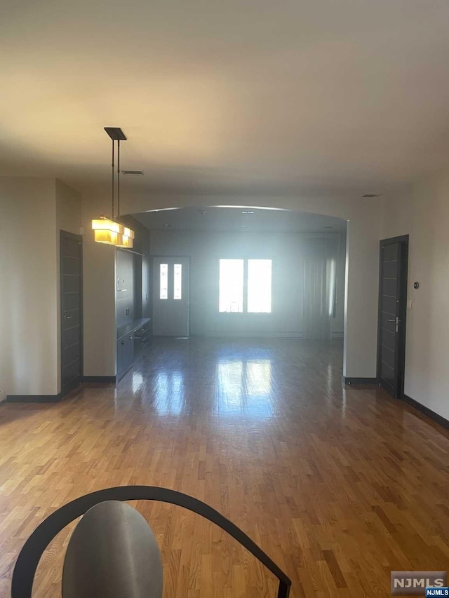 empty room featuring wood-type flooring