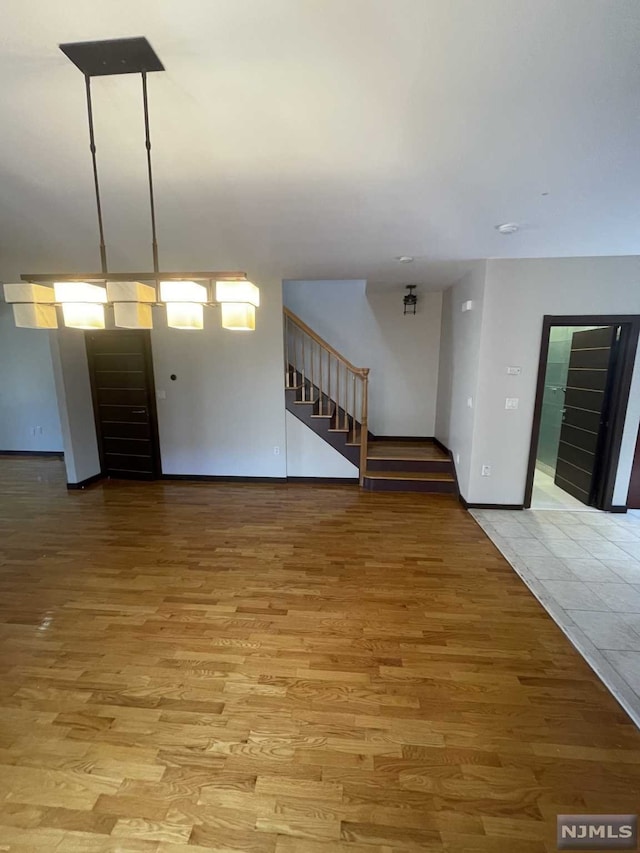 unfurnished living room featuring light hardwood / wood-style flooring