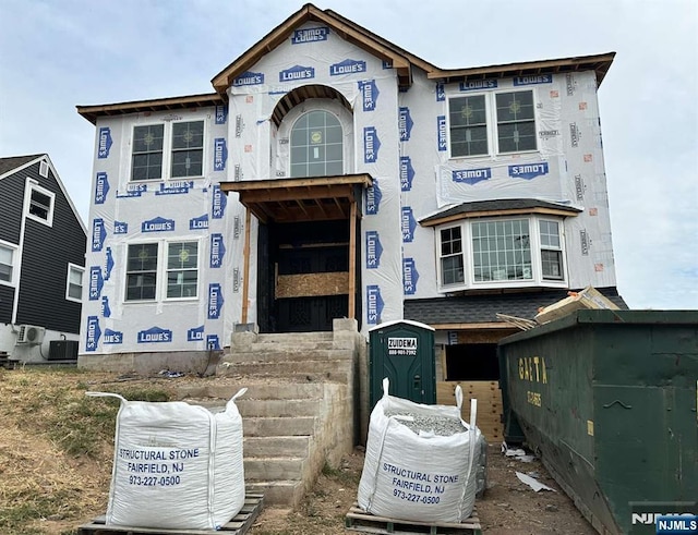 property under construction with central AC unit