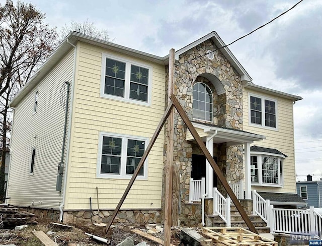 view of front facade featuring stone siding