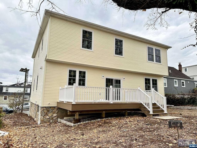 rear view of house with a deck