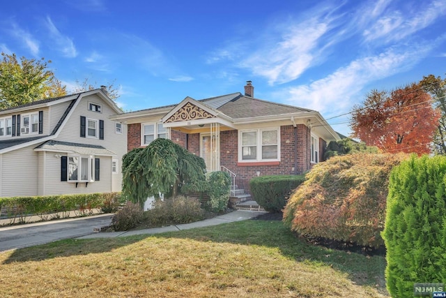 view of front of home with a front yard