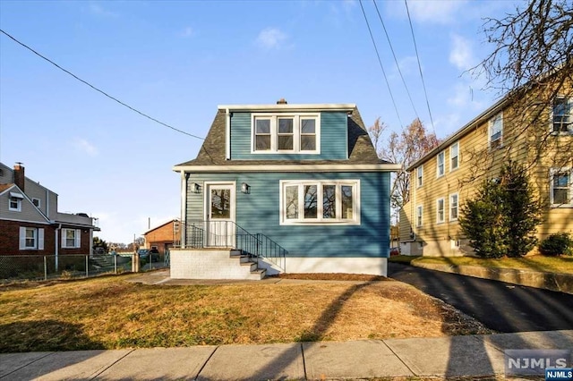 bungalow with a front lawn