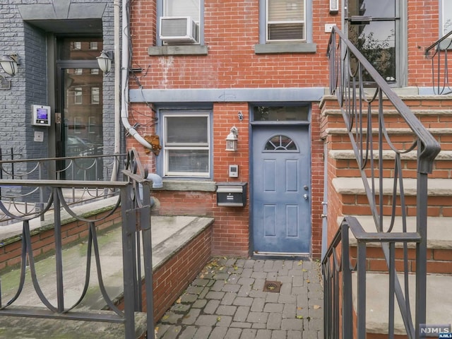 property entrance featuring cooling unit