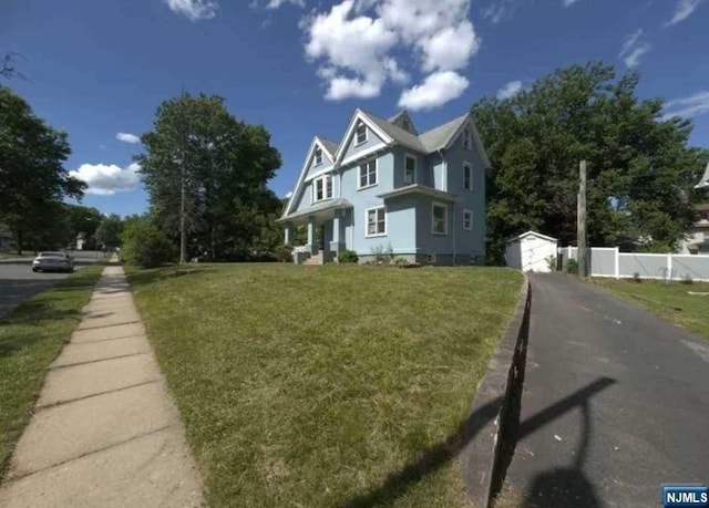 view of property exterior with a yard