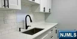 kitchen with white cabinets and sink