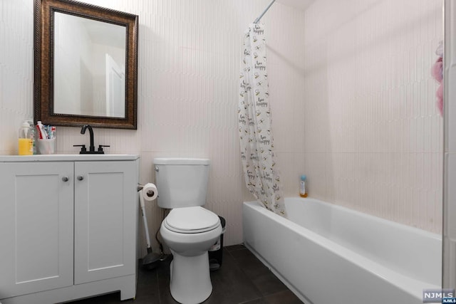 full bathroom with vanity, tile patterned floors, toilet, shower / bathtub combination with curtain, and tile walls