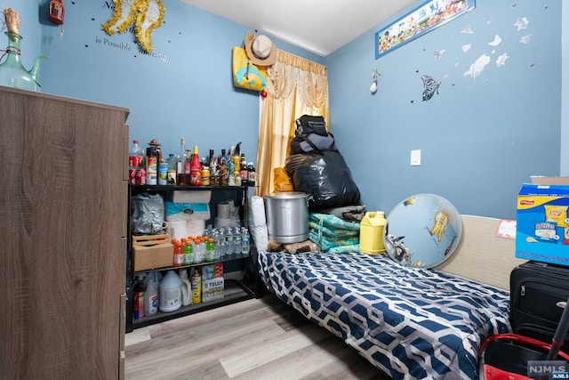 bedroom with light wood-type flooring